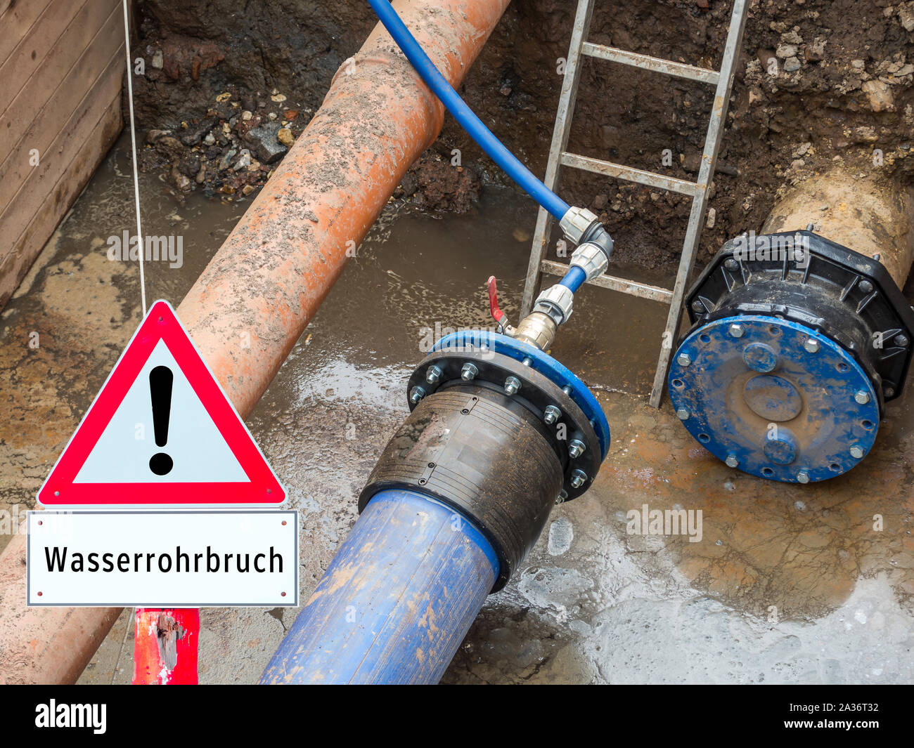 Warning sign water pipe break Stock Photo
