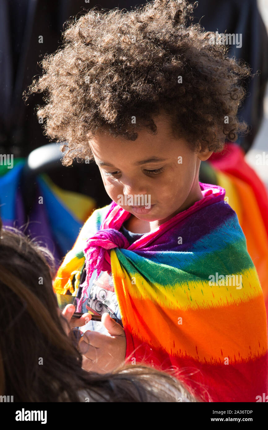 Gothenburg, Sweden. 05th Oct, 2019. A child with LGBT flag seen during the Manifestation for regnbagsflaggan in Gothenburg.Hundreds of flag-waving Goths stood up for everyone's equal value during Saturday's Rainbow Flag Manifestation at Gotaplatsen. The initiative for the manifestation was taken by Musican against Racism. Credit: SOPA Images Limited/Alamy Live News Stock Photo