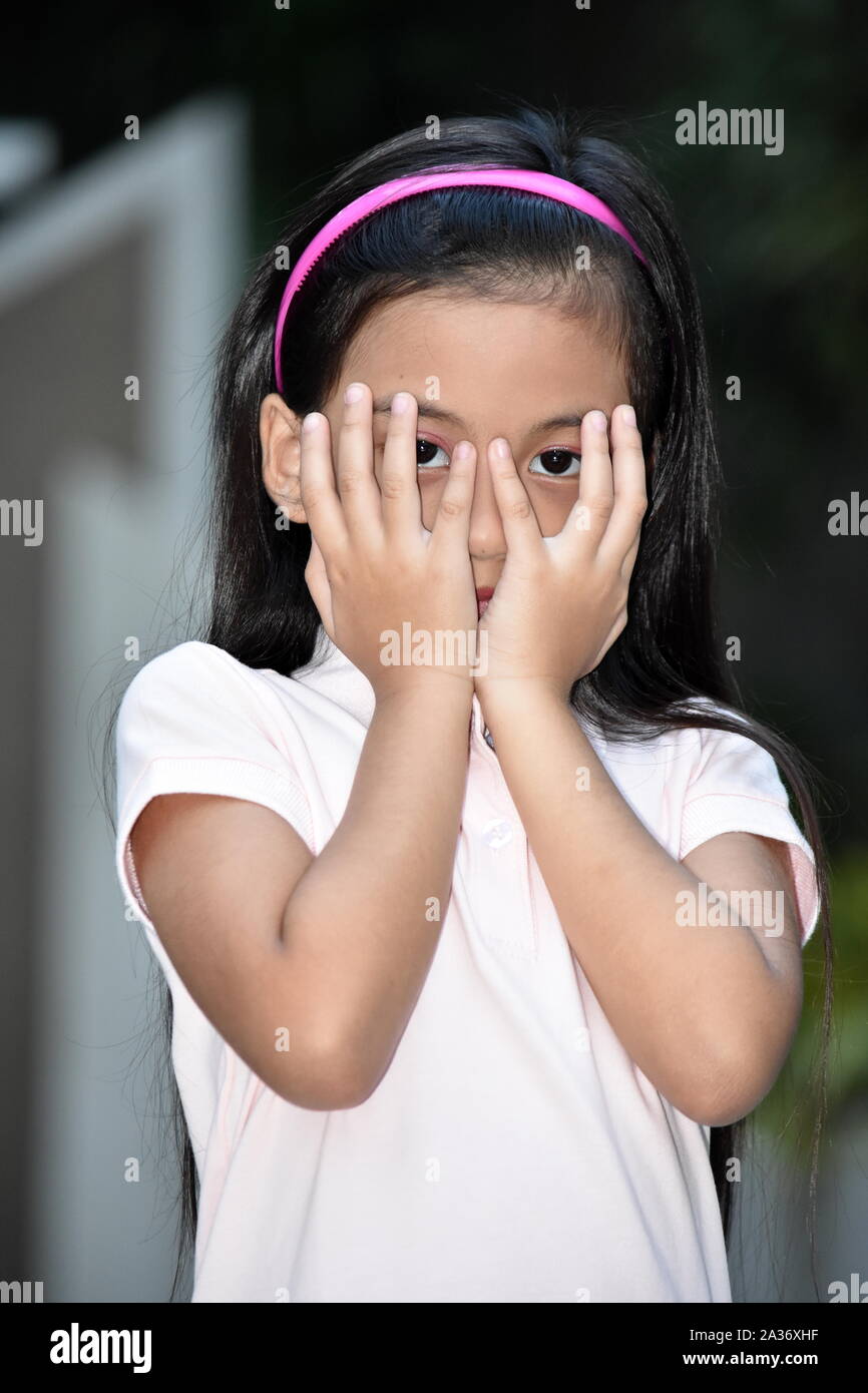 An Ashamed Beautiful Filipina Girl Youth Stock Photo