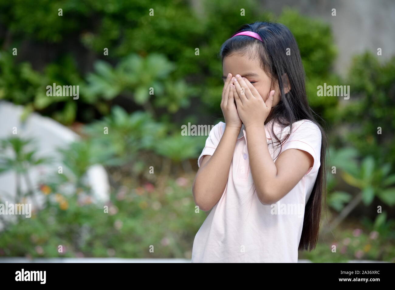 Petite Asian Girl Child And Failure Stock Photo