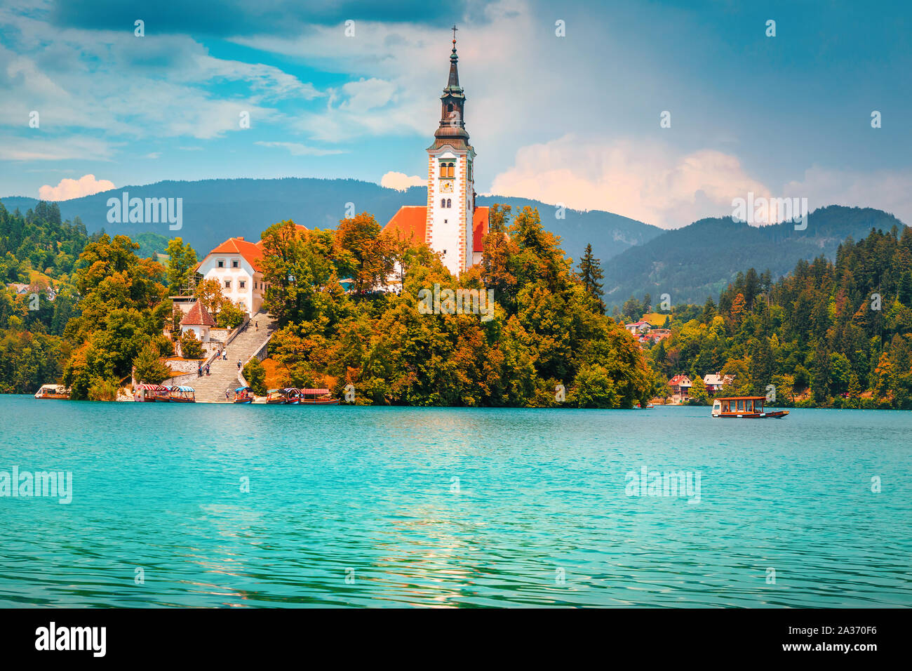 Breathtaking touristic and excursion place at autumn. Spectacular and majestic lake Bled with famous Pilgrimage church on small island, Bled, Slovenia Stock Photo