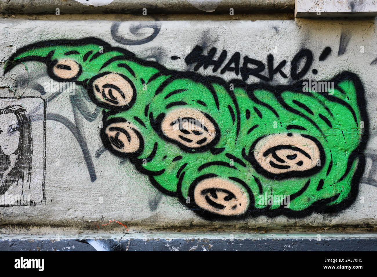 Green tentacle graffiti by Sharko on the wall in Trastevere district, Rome, Italy Stock Photo