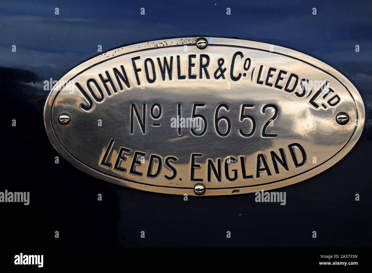 Close up of the nameplate on a Fowler Showman's traction engine on display at Tyseley Railway Centre, Birmingham, UK Stock Photo
