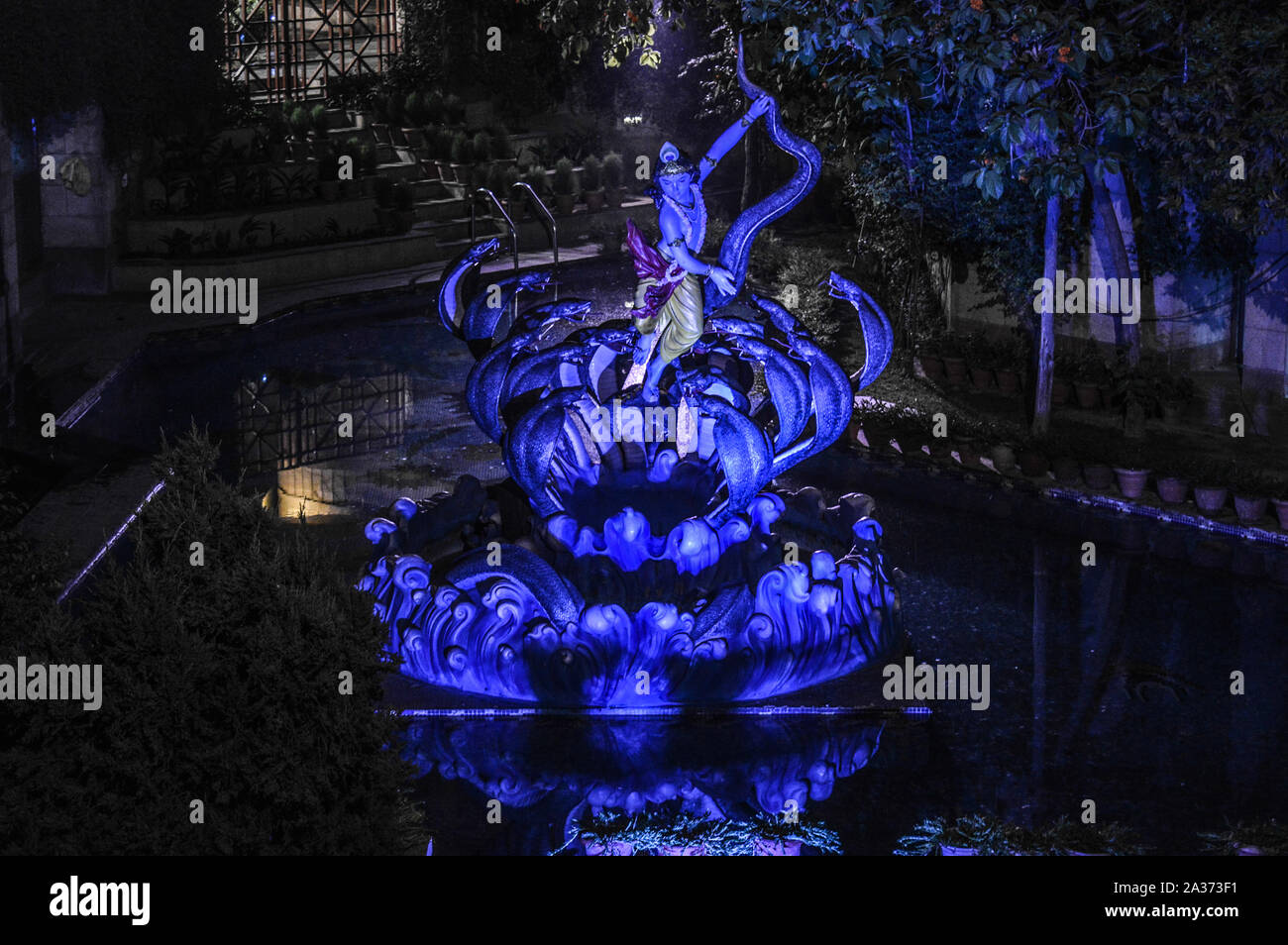 Lord krishna doing dance on the snake with blue light on iskcon temple new delhi india Stock Photo