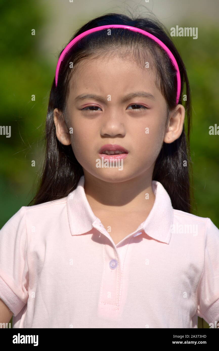 An An Unhappy Filipina Person Stock Photo