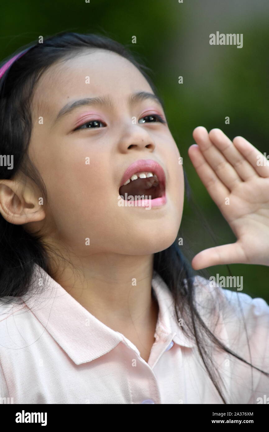 An A Young Girl Yelling Stock Photo
