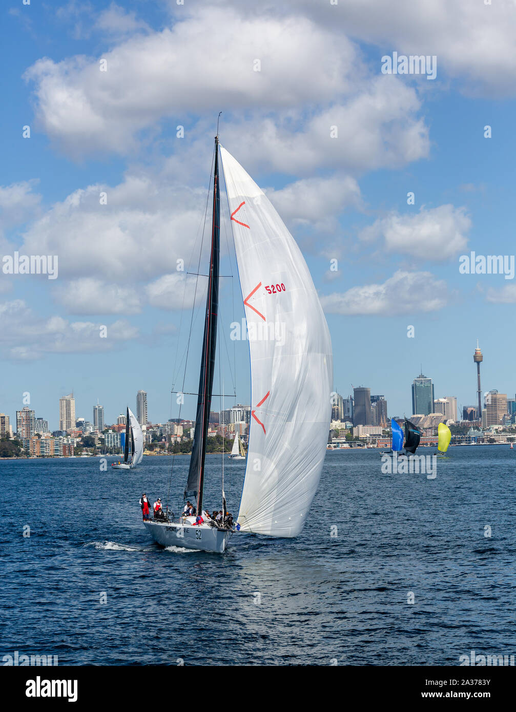 Ocean going yacht with wind in white sail in sydney harbour, sydney, australia on 27 Septemebr 2019 Stock Photo