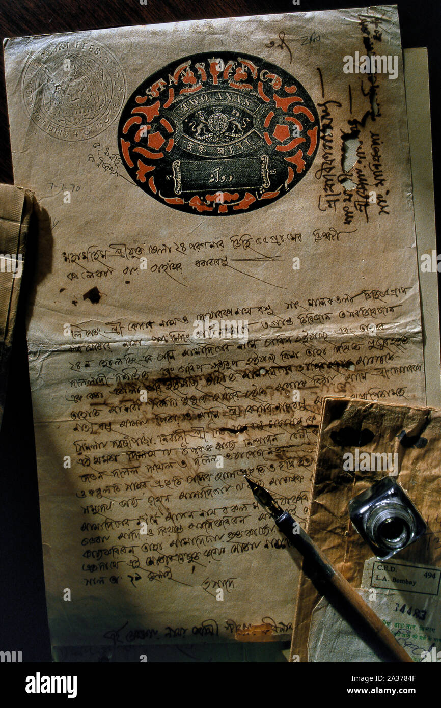 Antique handwritten legal document on parchment paper in Bengali Old