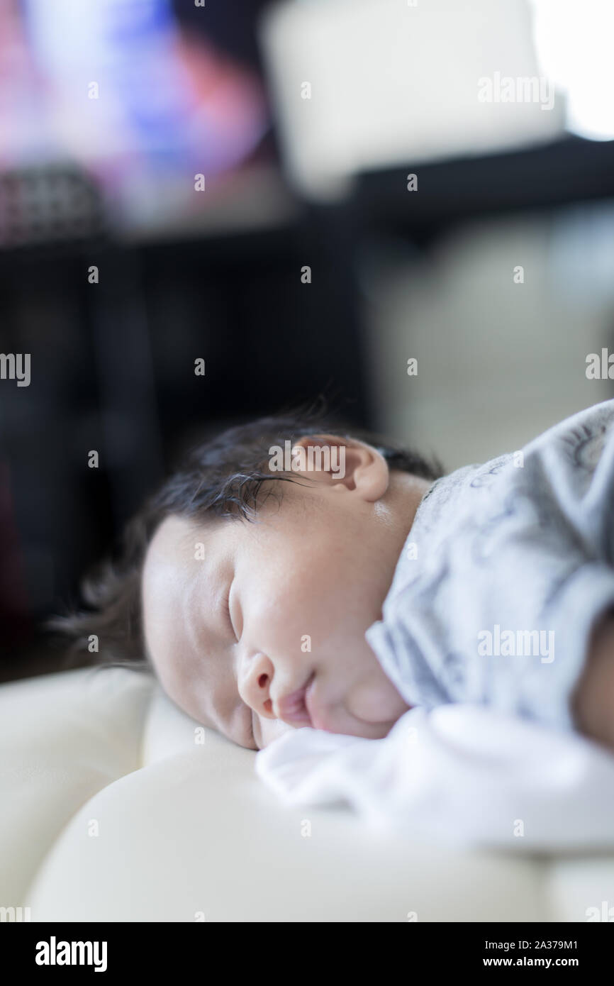 adorable baby sleeping on stomach on bed Stock Photo Alamy