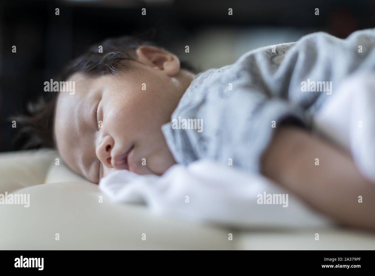 adorable baby sleeping on stomach on bed Stock Photo Alamy