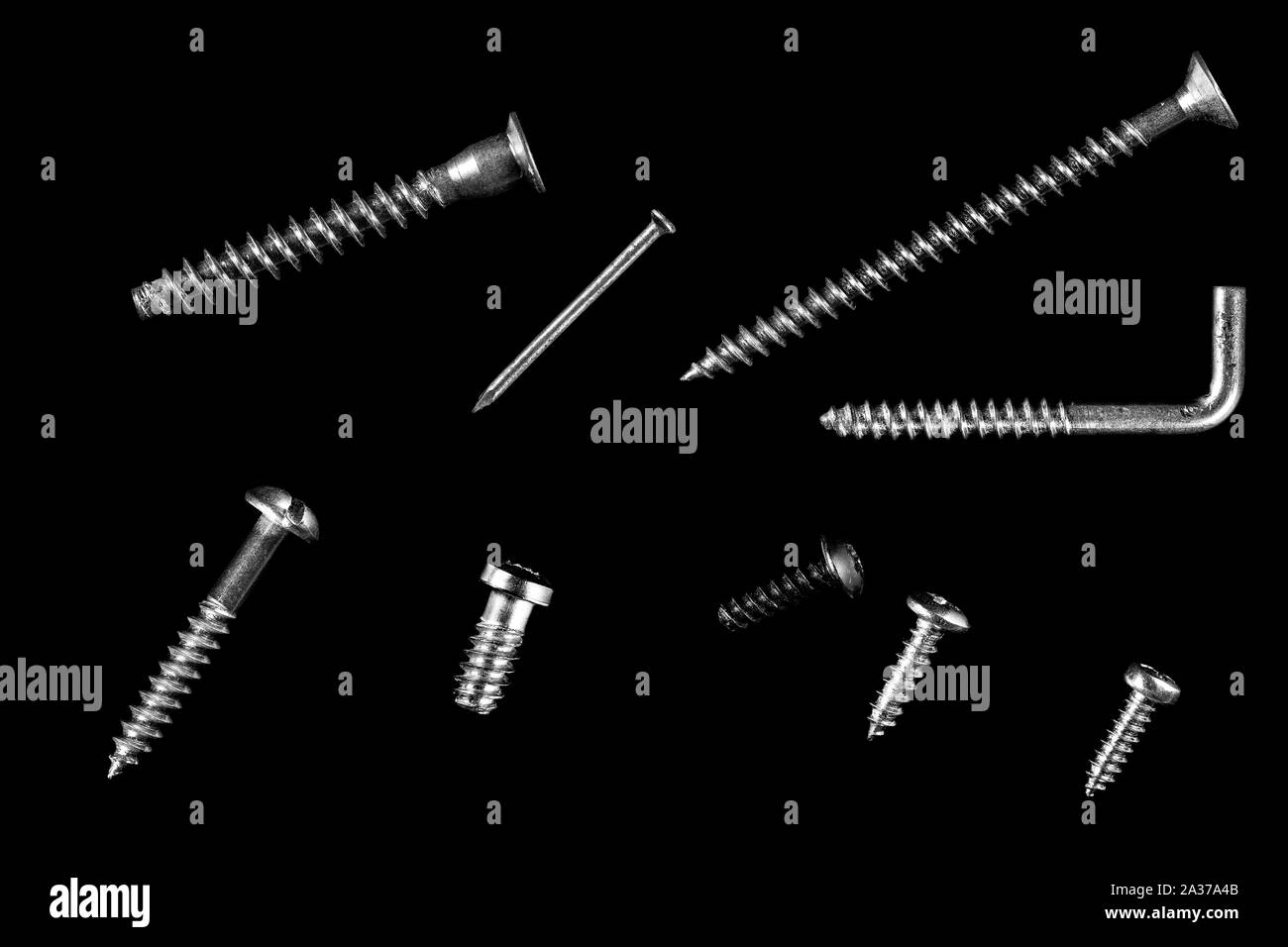 different types of screws on black isolated background Stock Photo