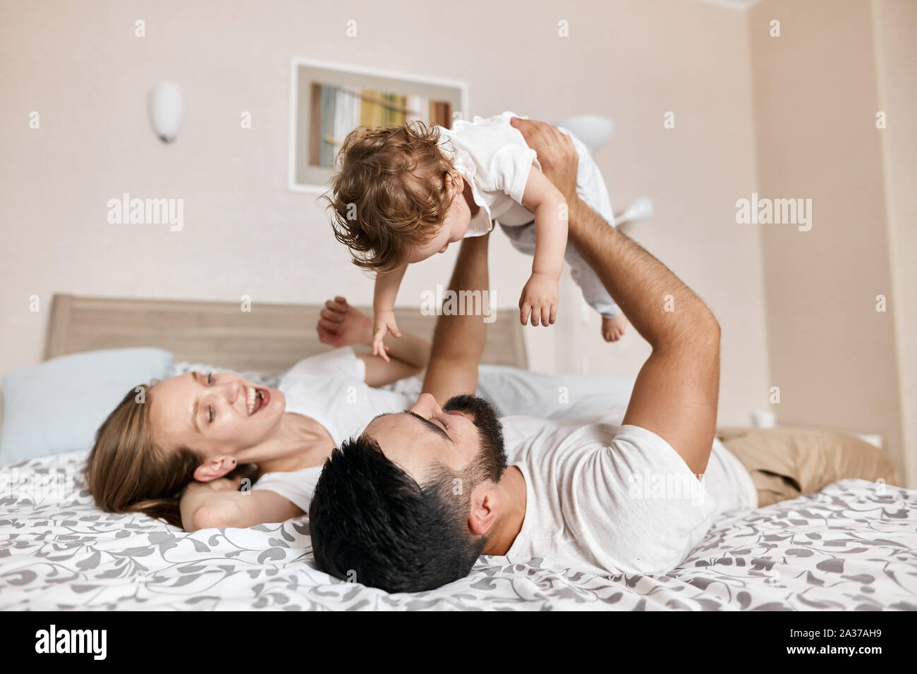positive couple entertaining their babym sining songs to her. close up  photo, relationship, happy moments of life Stock Photo - Alamy