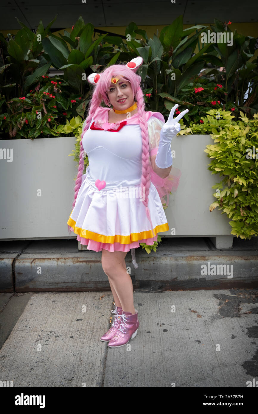 A young lady dressed as a character from Sailor Moon, a Japanese shōjo manga series written and illustrated by Naoko Takeuchi. At Comic Con in NYC. Stock Photo