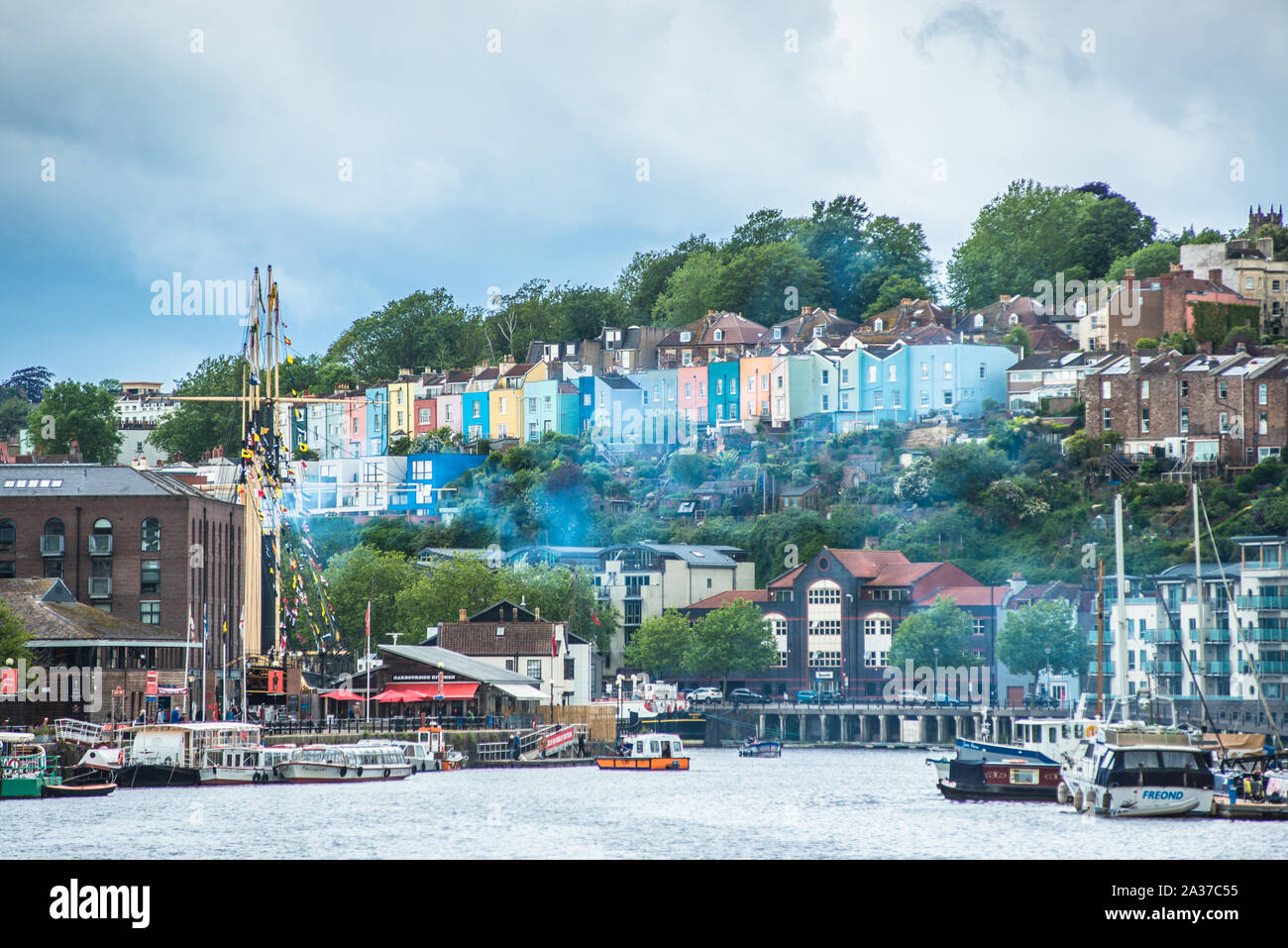Colourful houses across the harbour at Hotwells with steam coming from SS Great Britain in Bristol, England, UK Stock Photo