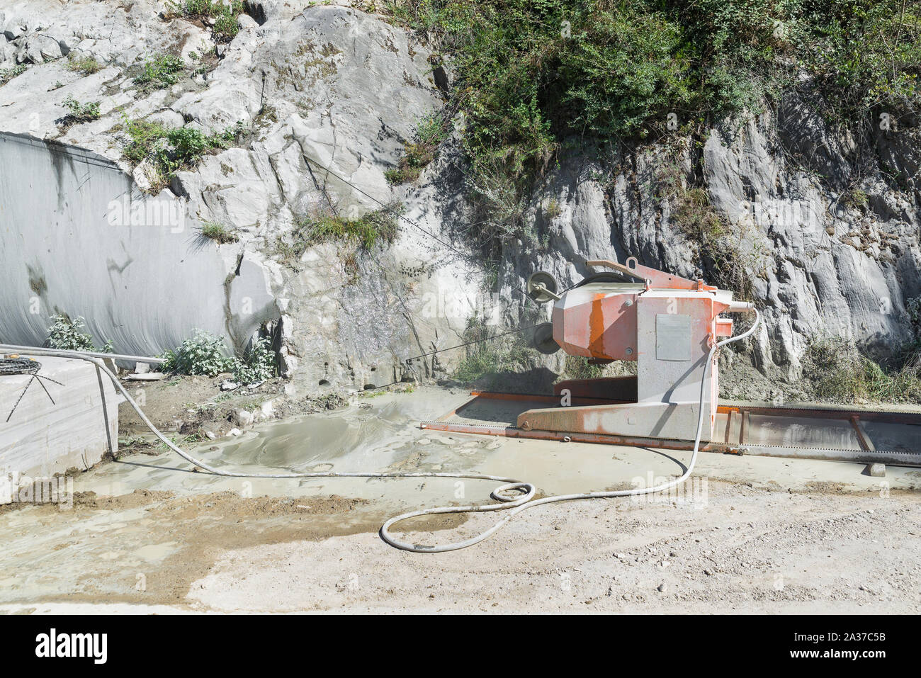 Marble cutting machine. Machine during the cutting phase in a quarry. Stone processing Stock Photo