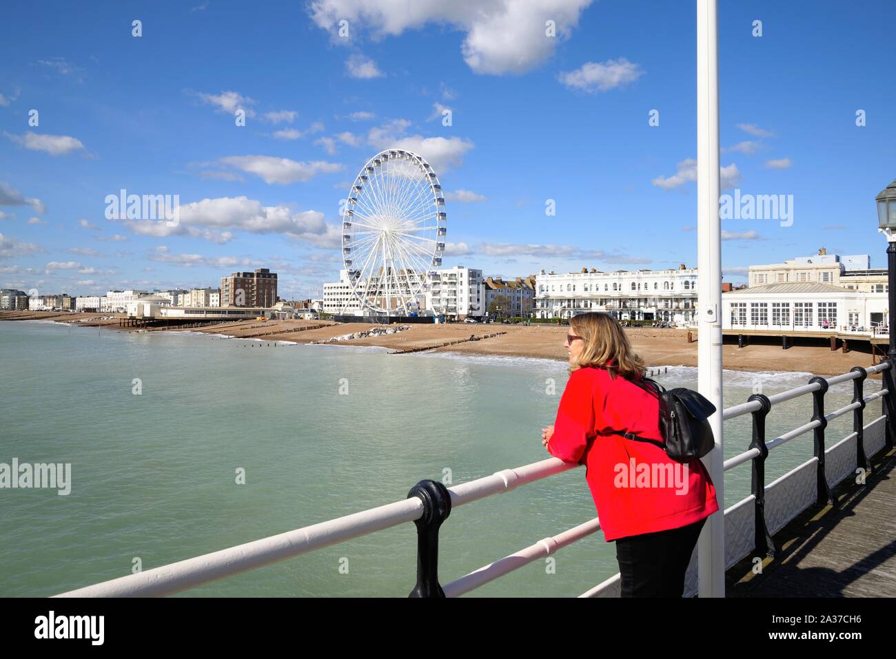 The Big Ferris Wheel on Worthing seafront as seen from the pier on a sunny summers day, West Sussex England UK Stock Photo