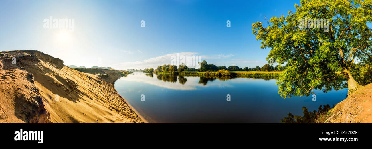 Summer landscape with river, sun and blue sky Stock Photo - Alamy