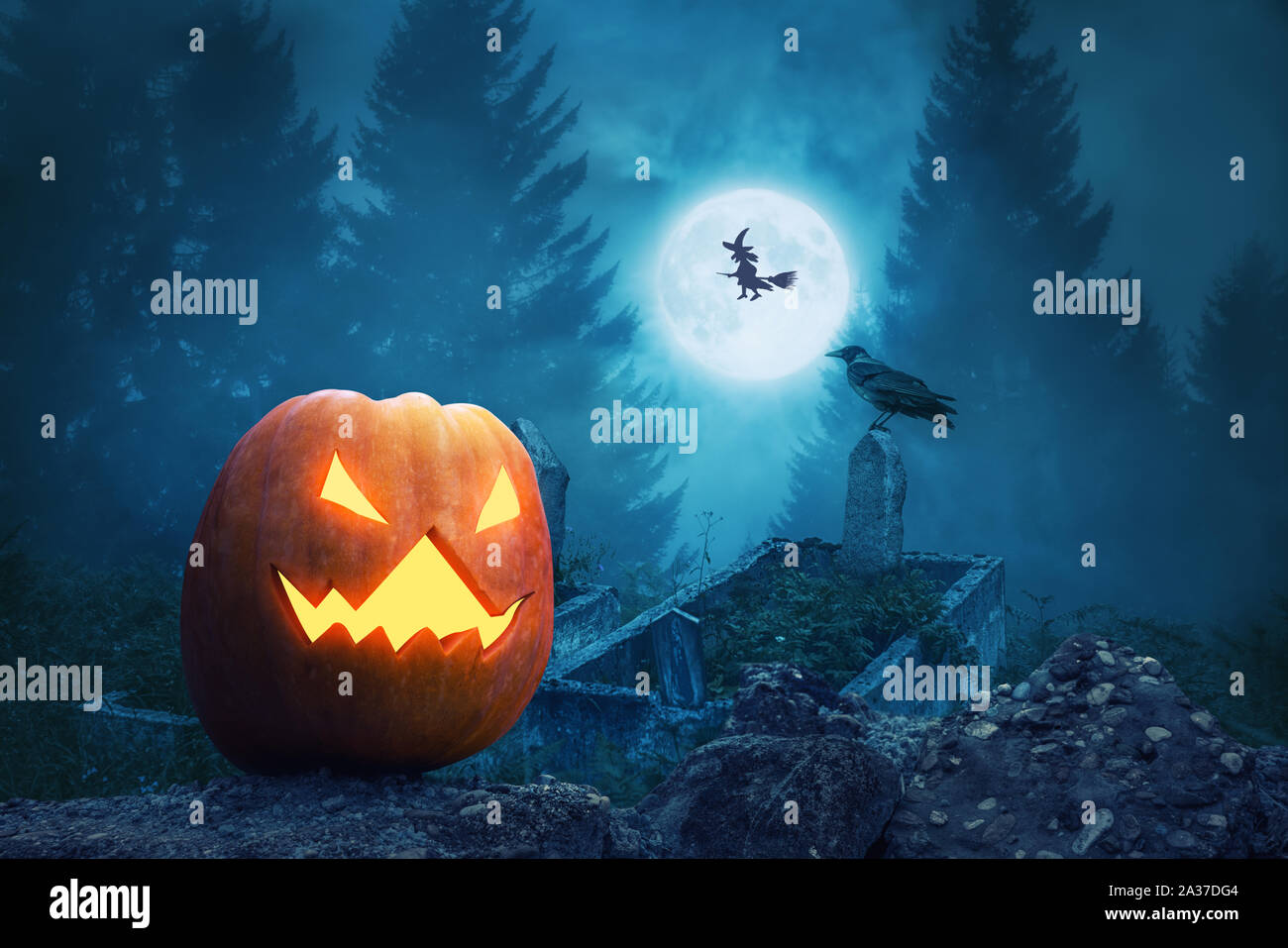 Spooky pumpkin lantern in the scary graveyard for Halloween. Stock Photo