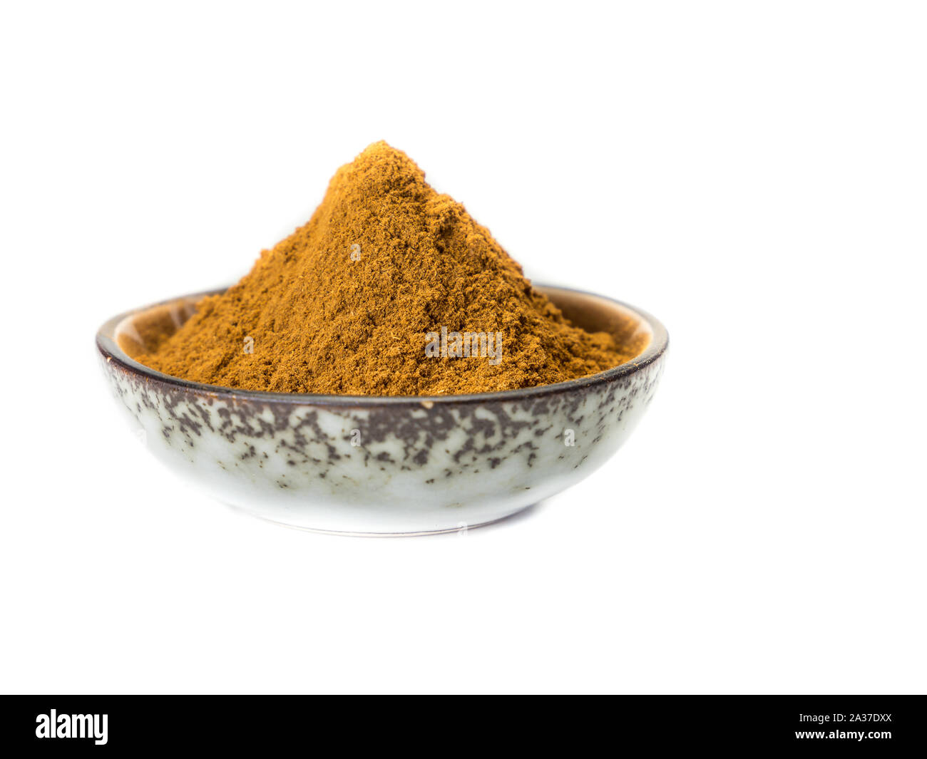 Cinnamon in a bowl Stock Photo Alamy