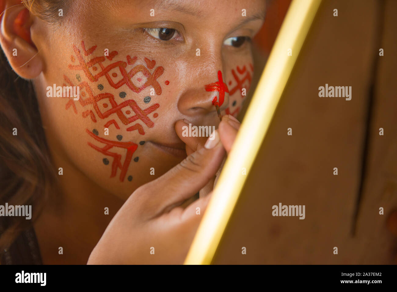 Ashaninka girl with red face paint Stock Photo - Alamy
