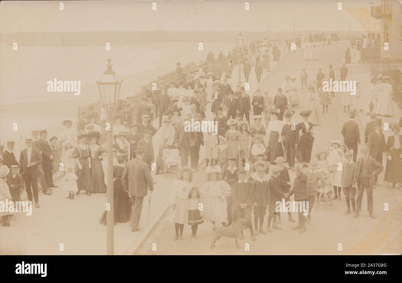 Vintage Early 20th Century Photographic Postcard Showing a Large Group of People at a British Seaside Location. Stock Photo