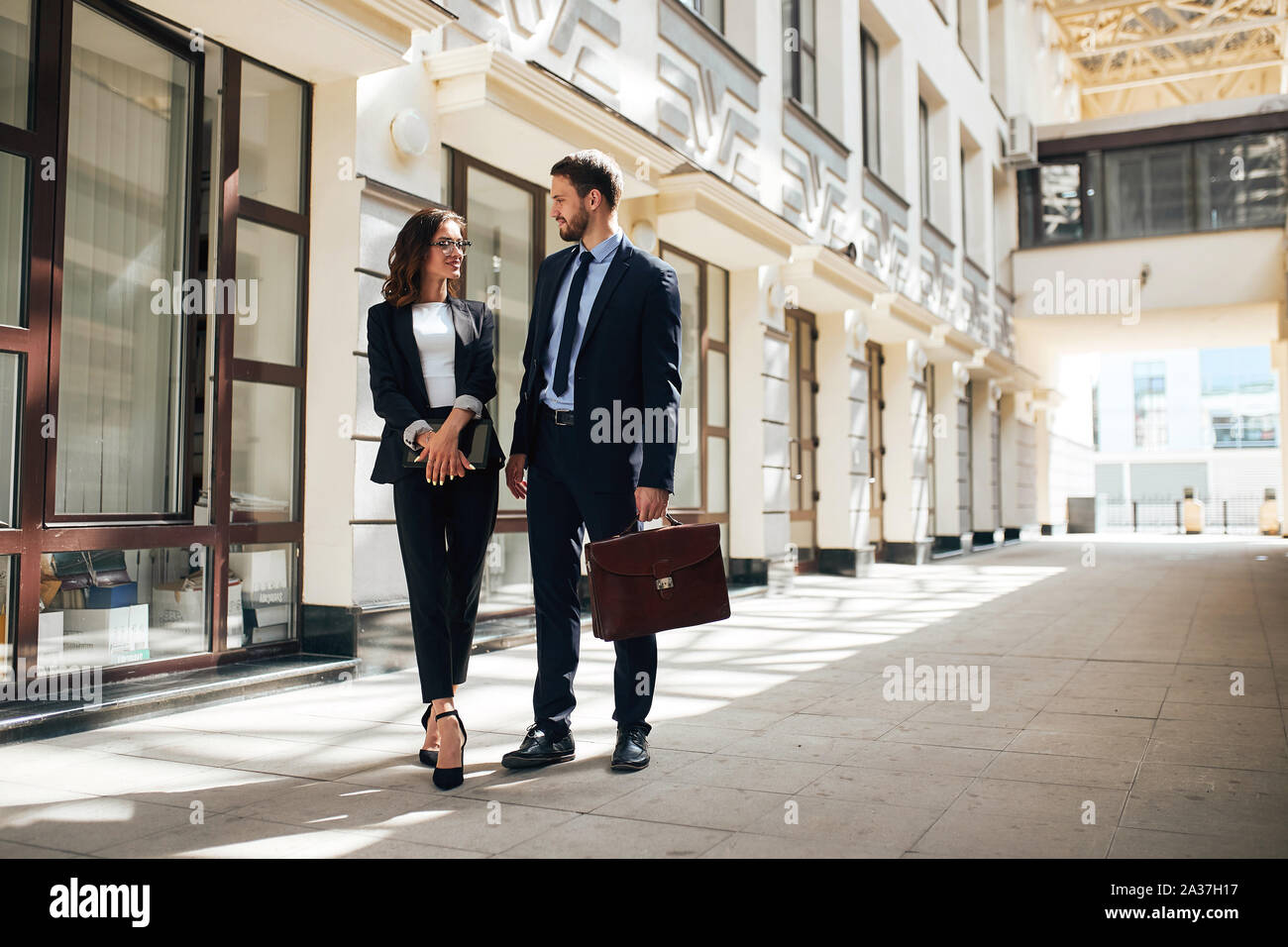 co-workers walking in the business city center.copy space. man consulting intern,trainee. internship Stock Photo