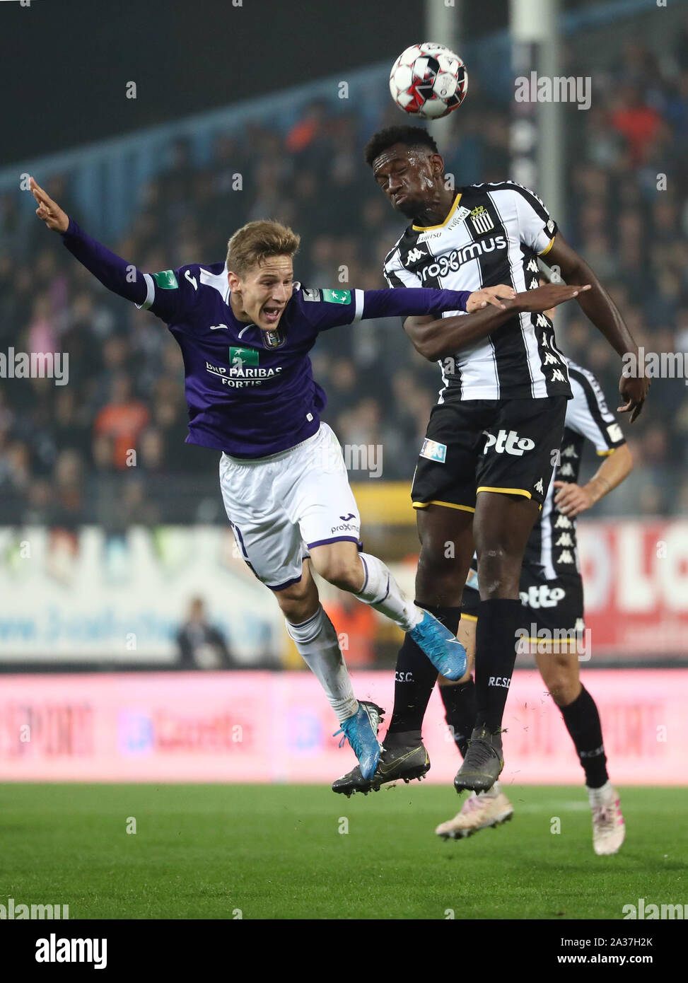 CHARLEROI, BELGIUM - OCTOBER 04: Yari Verschaeren of Anderlecht battles for  the ball with Frank Tsadjout of Charleroi during the Jupiler Pro League  match day 10 between Sporting Charleroi and RSC Anderlecht