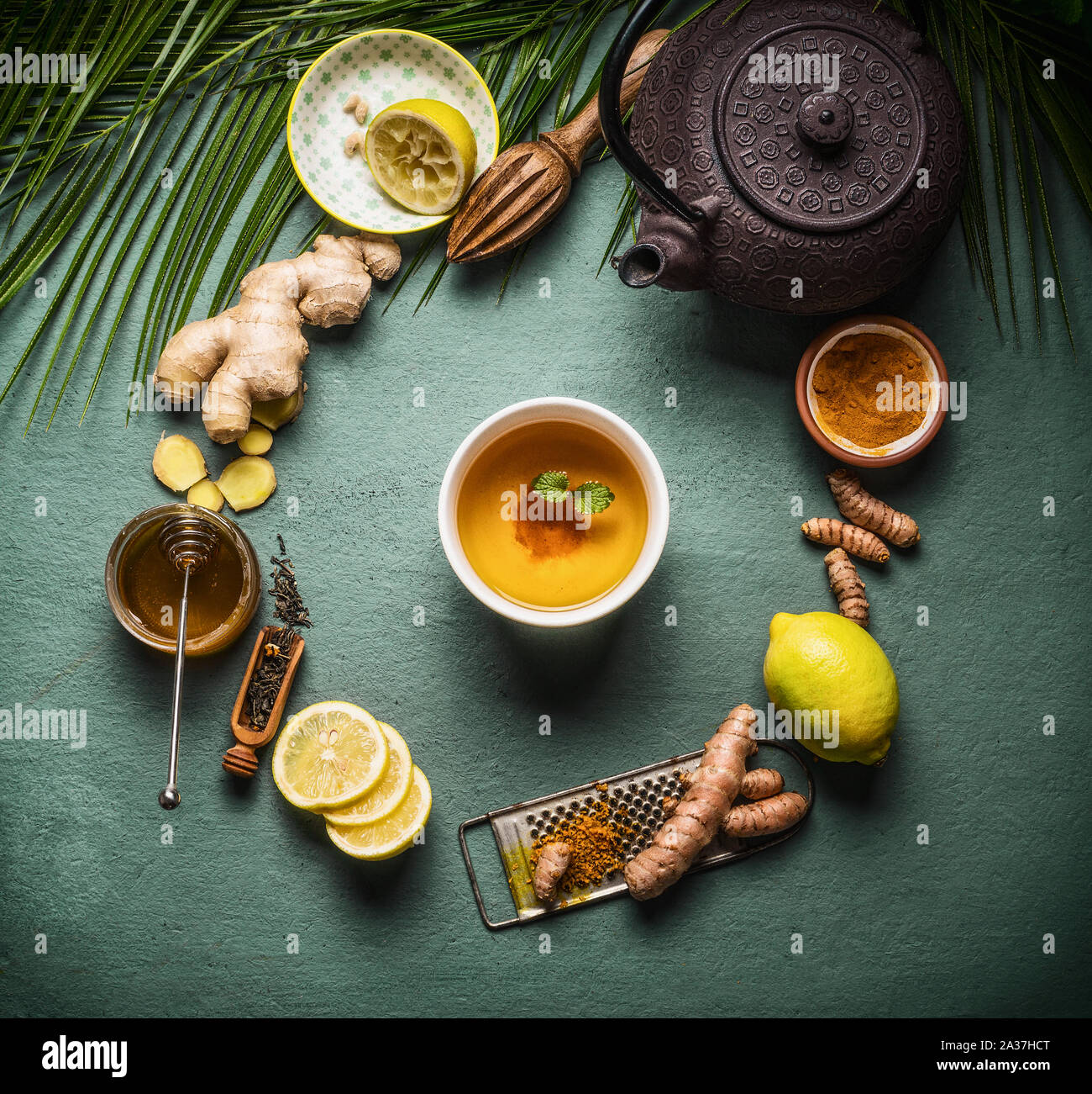 Cup of healthy herbal turmeric tea with ingredients. Top view Stock