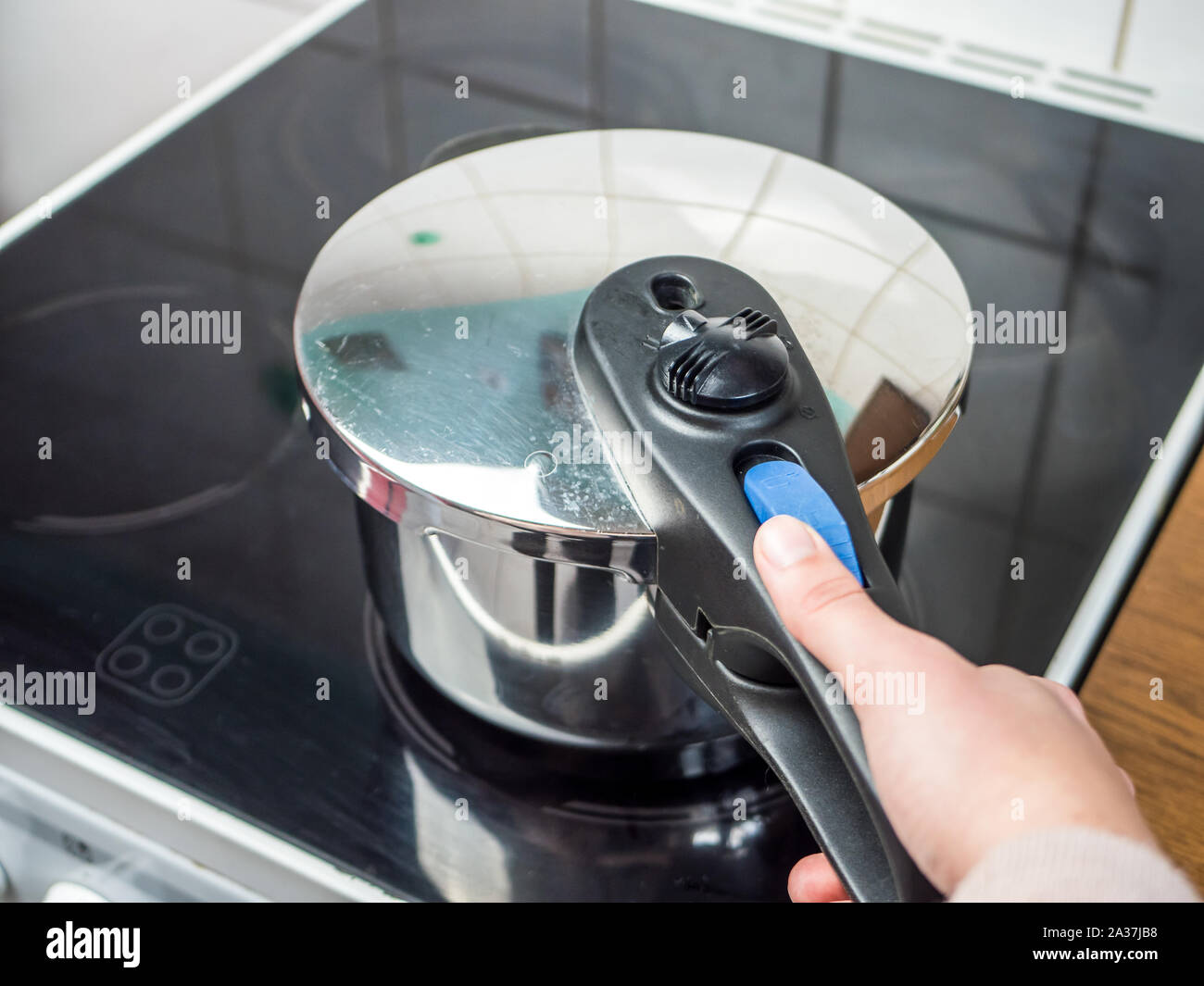 Saving electricity with a pressure cooker Stock Photo Alamy