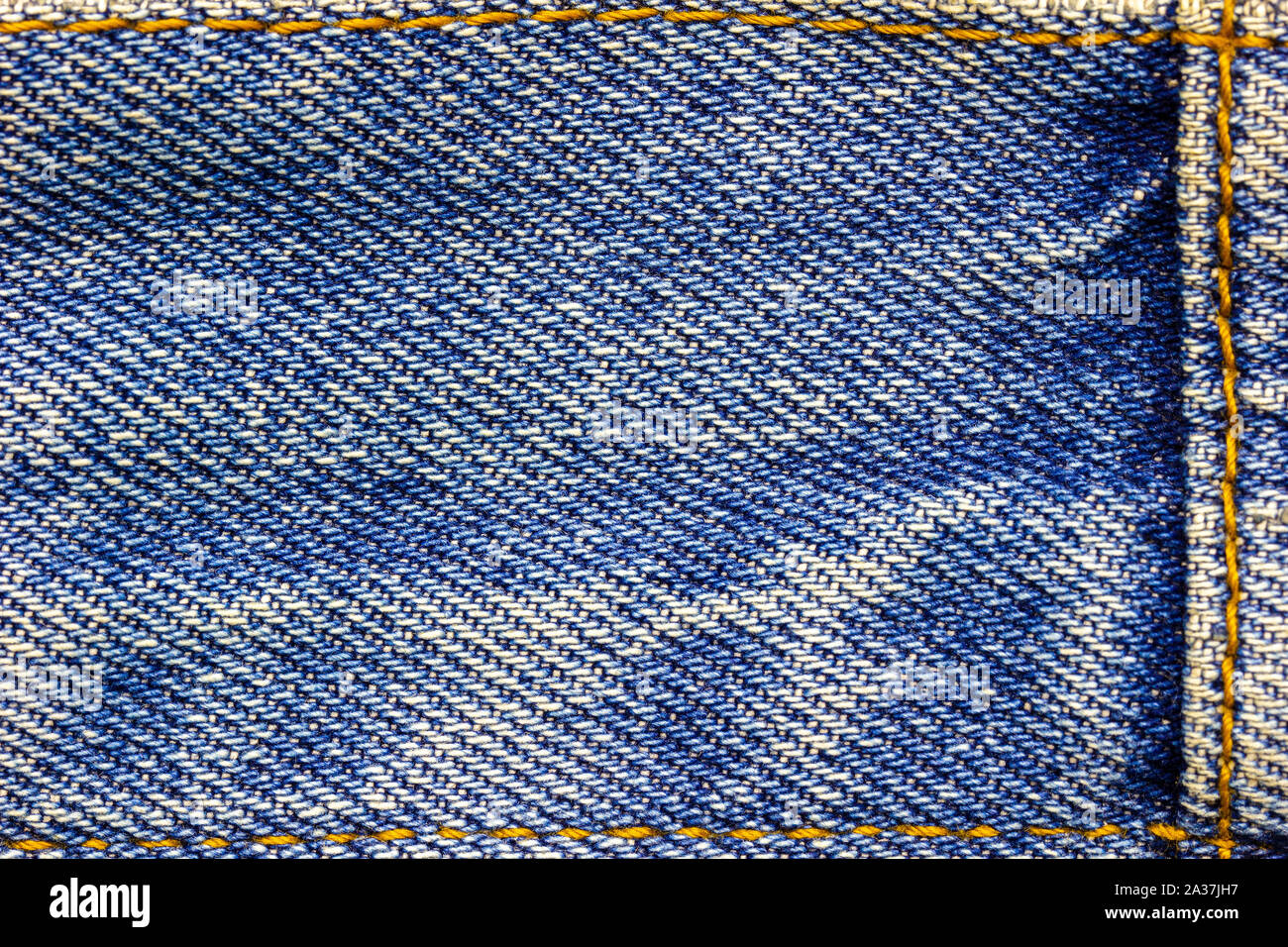 Frame or border of jeans fabric stitch. Concept of vintage clothes or fashion. Stock Photo