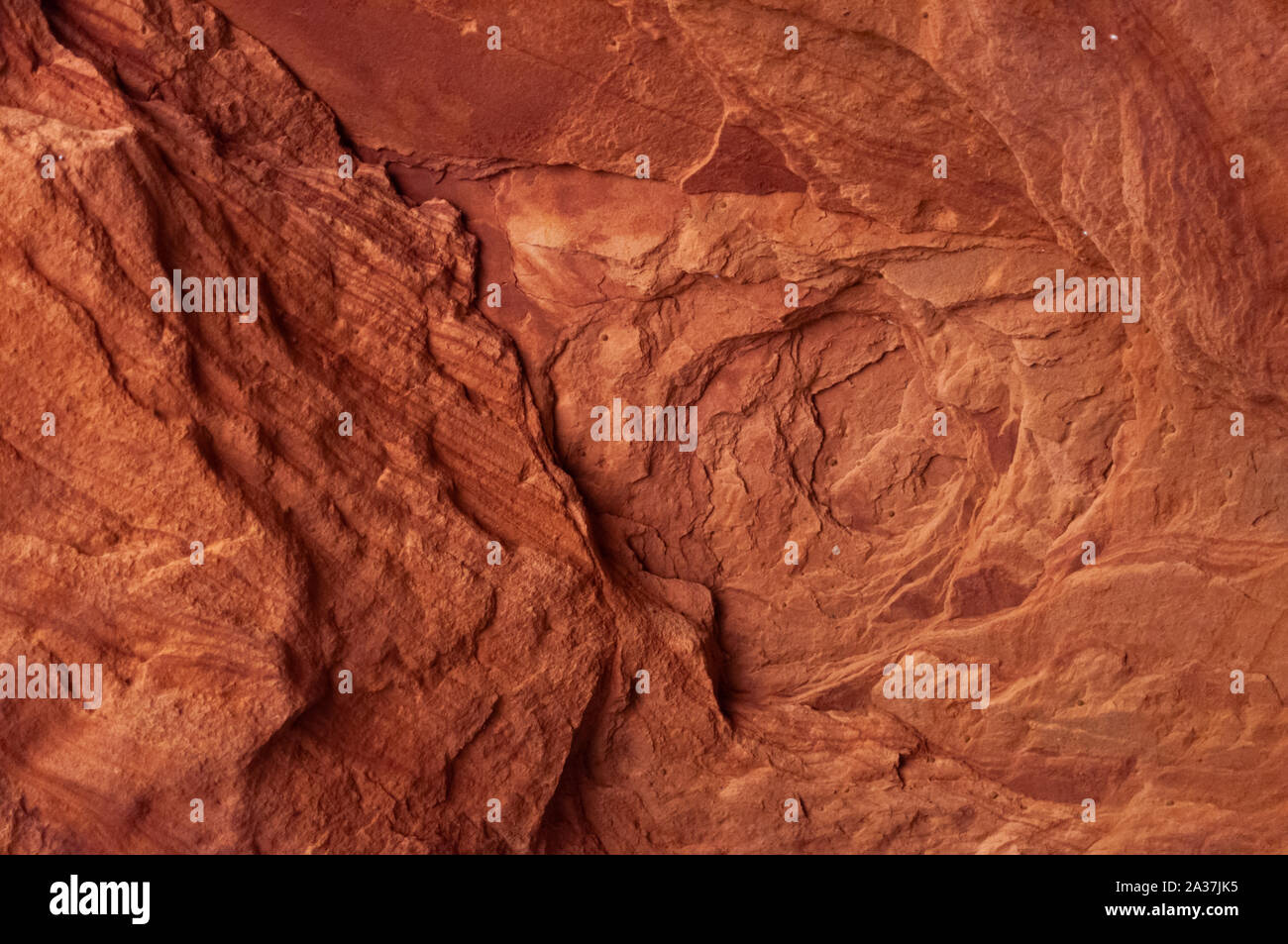 Colorful sandstone walls eroded by time and water to create smooth layers in Rozhdestveno. Stock Photo