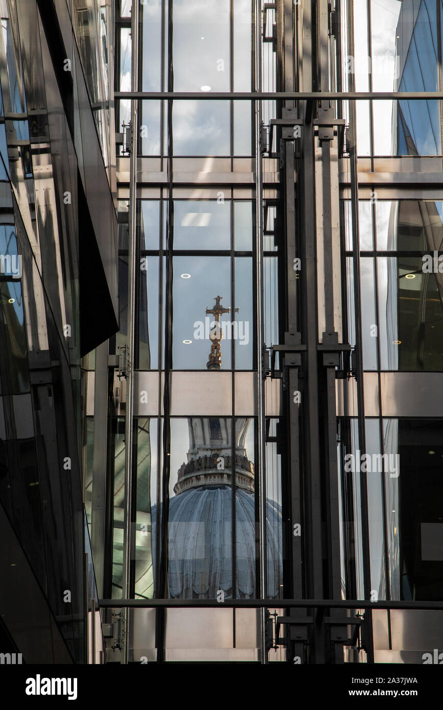 A reflection of St Paul's Cathedralin the modern windows of 1 New Change, Cheapside in the City of London Stock Photo