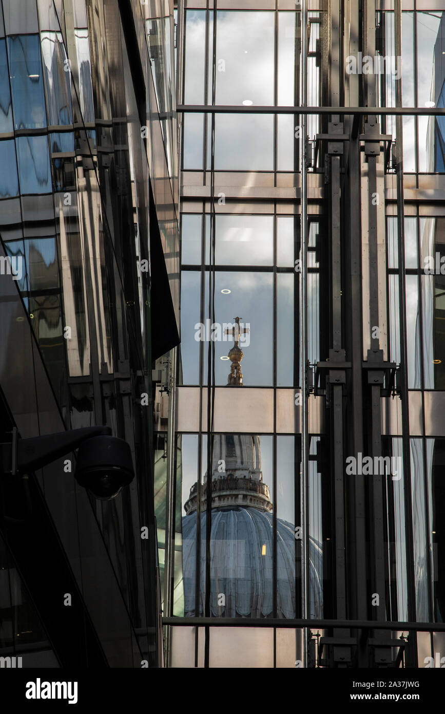 A reflection of St Paul's Cathedralin the modern windows of 1 New Change, Cheapside in the City of London Stock Photo
