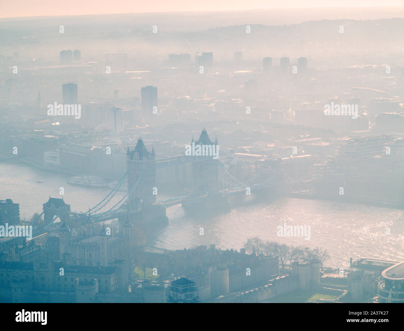 Dramatic shots of Tower Bridge and south London on a smoggy morning from high above Stock Photo