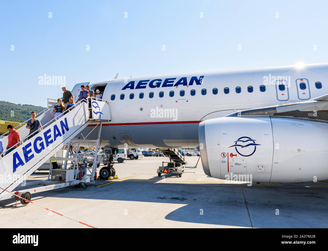 Passengers exiting an Aegean Airlines plane at Diagoras airport, Rhodes Island, Greece Stock Photo