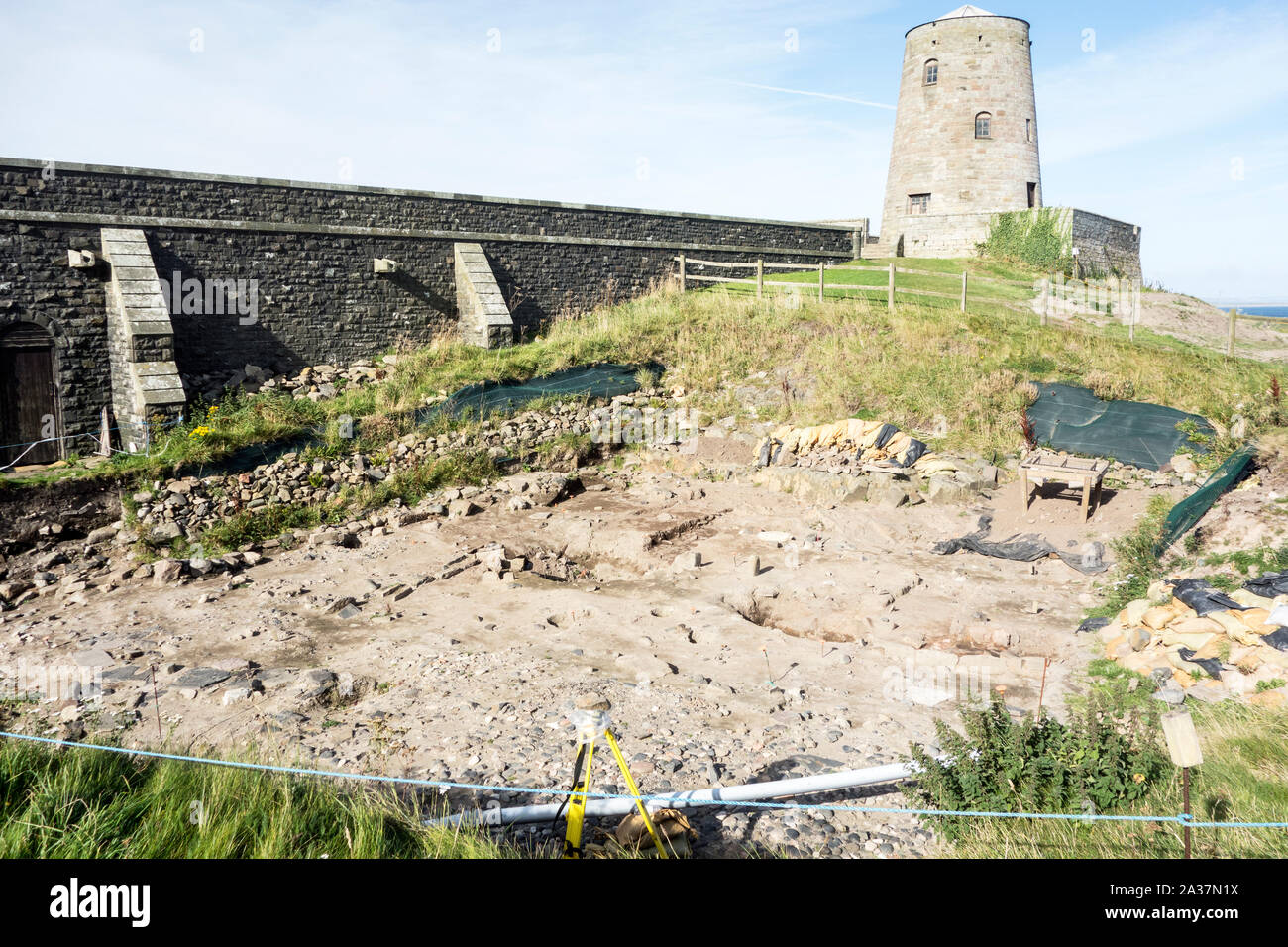 The ongoing archaeological excavation / dig within the grounds of Bamburgh Castle Northumberland UK Stock Photo