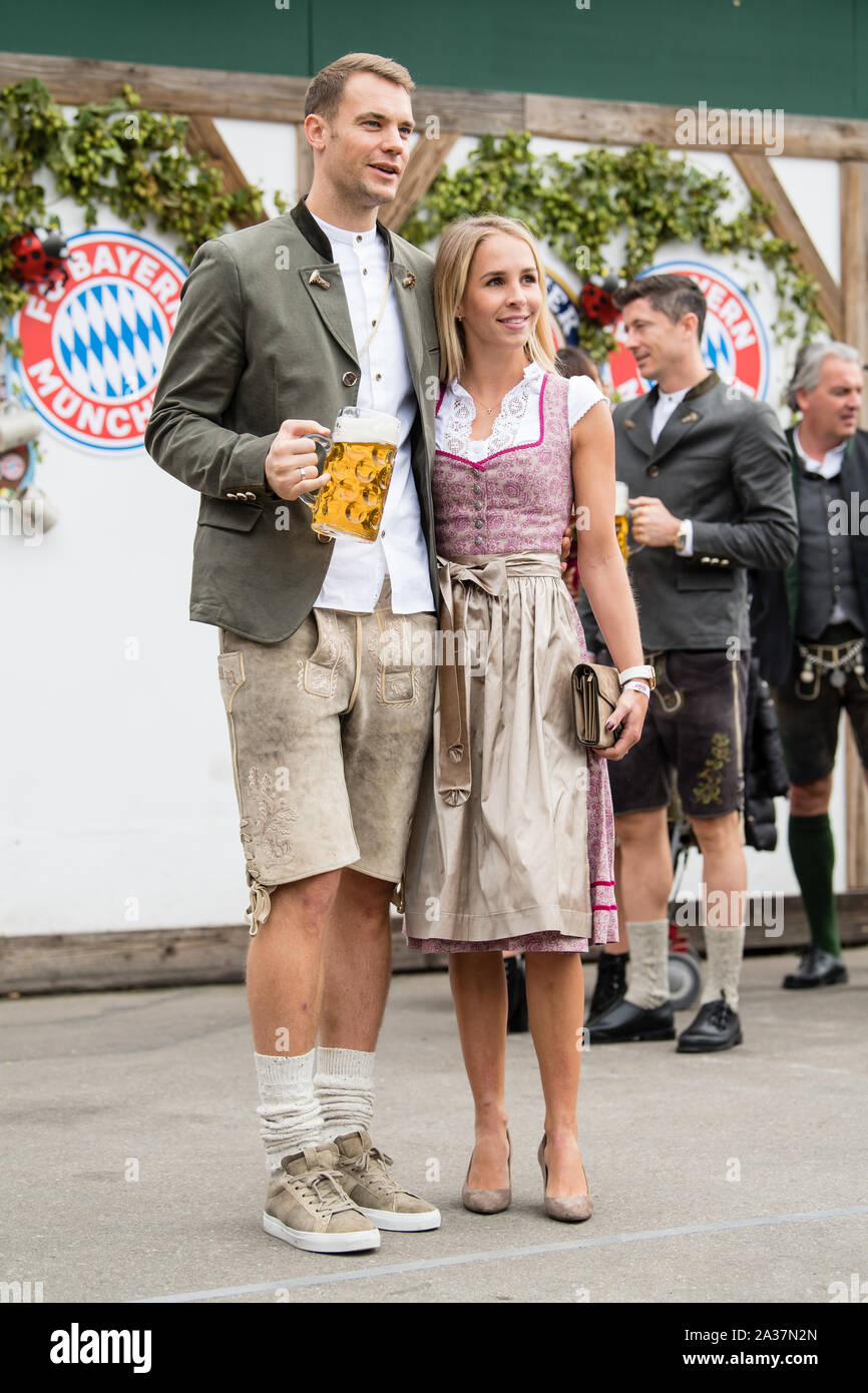 Munich, Germany. 06th Oct, 2019. Goalkeeper Manuel Neuer and his wife Nina Weiss come to the beetle tent at the Oktoberfest on the Theresienwiese. Players, coaches and managers of the Bundesliga soccer team FC Bayern traditionally visit the Käfer tent together once during the Oktoberfest. Photo: Matthias Balk/dpa - Credit: dpa picture alliance/Alamy Live News Stock Photo