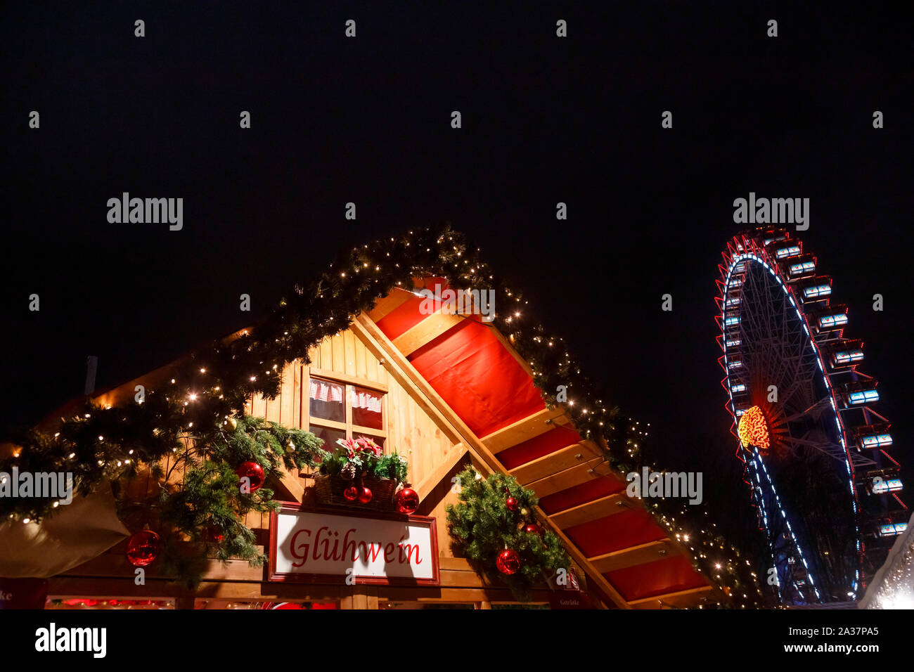 Illuminated Gluhwein (hot mulled wine) stall at Christmas market ...