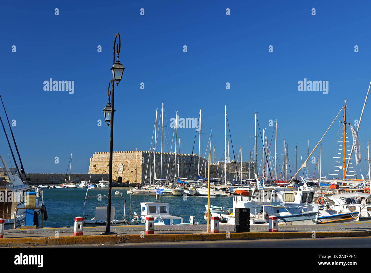 Old port of Heraklion with the fortress of Koules (Castello del Mare)  in the background. Stock Photo
