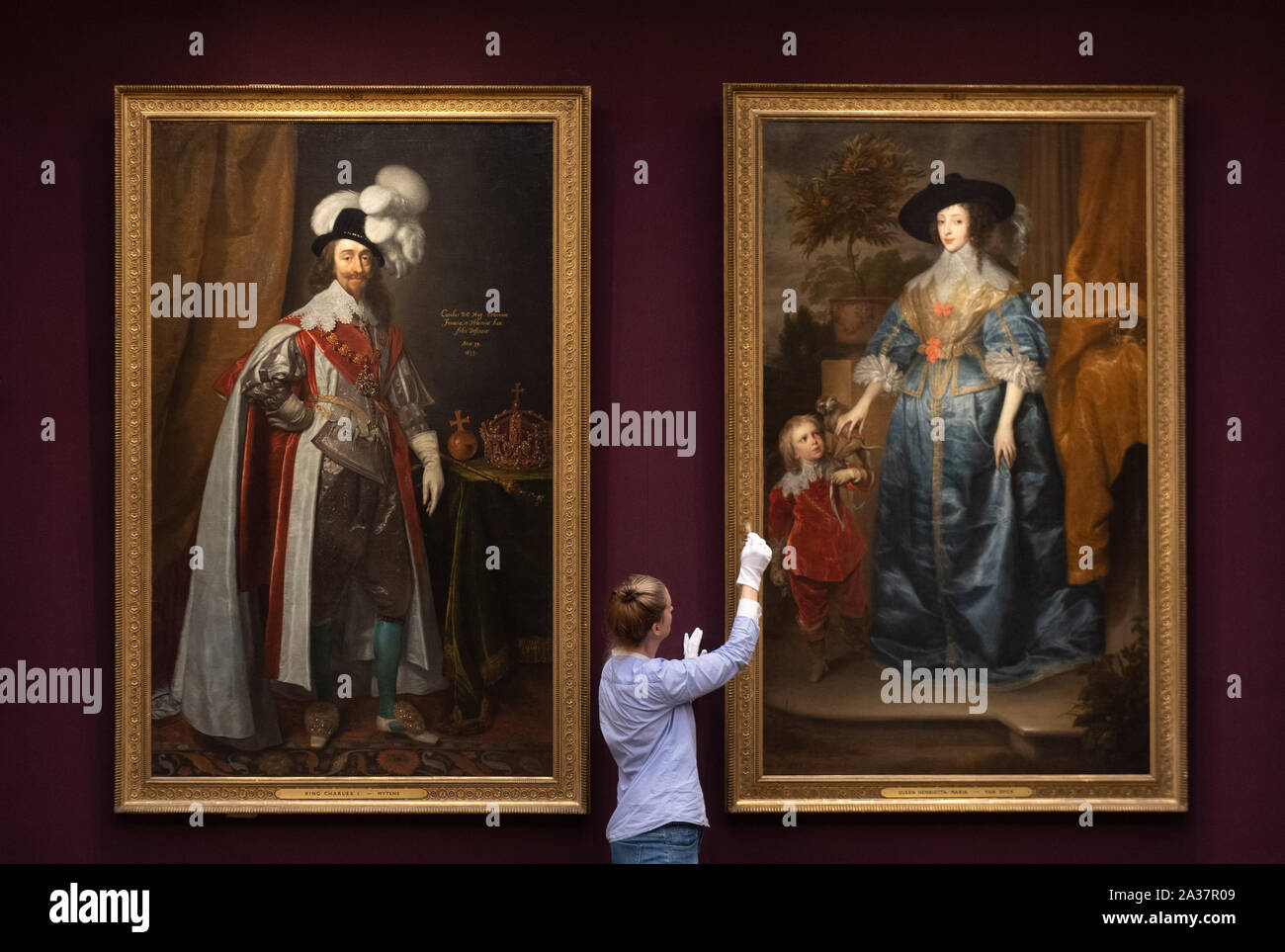 Oil paintings 'Portrait of King Charles I' by Daniel Mytens and 'Queen Henrietta Maria with Jeffrey Hudson' by Anthony van Dyck hang in newly refurbished the main gallery at the Fitzwilliam Museum in Cambridge featuring ornate plasterwork and casts of the Parthenon Frieze, widely considered to be one of the finest museum interiors in the world. Stock Photo