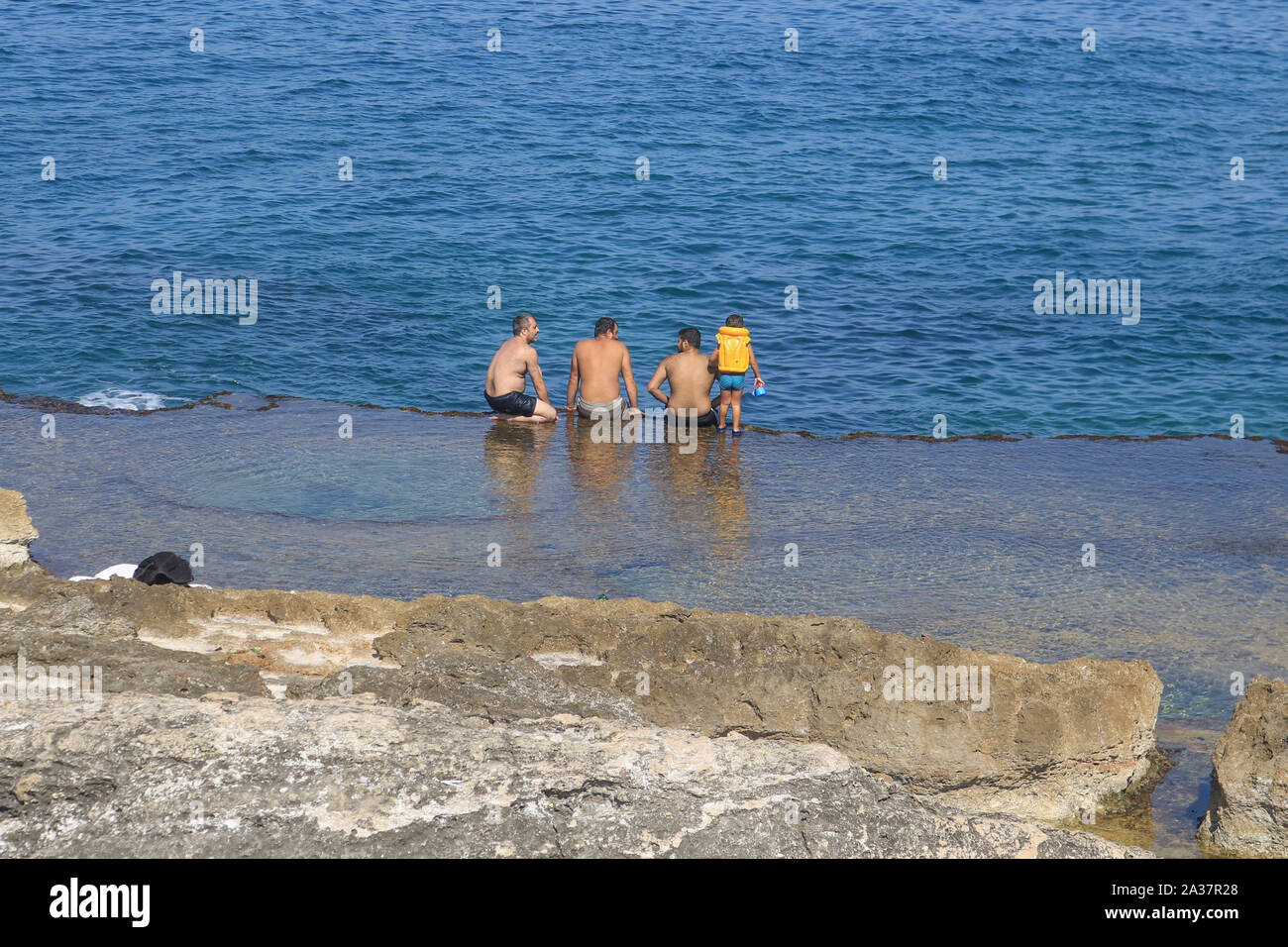 October 6, 2019, Beirut, Lebanon: People cool off at the shores of the sea during the hot and humid day  in Beirut. (Credit Image: © Amer Ghazzal/SOPA Images via ZUMA Wire) Stock Photo