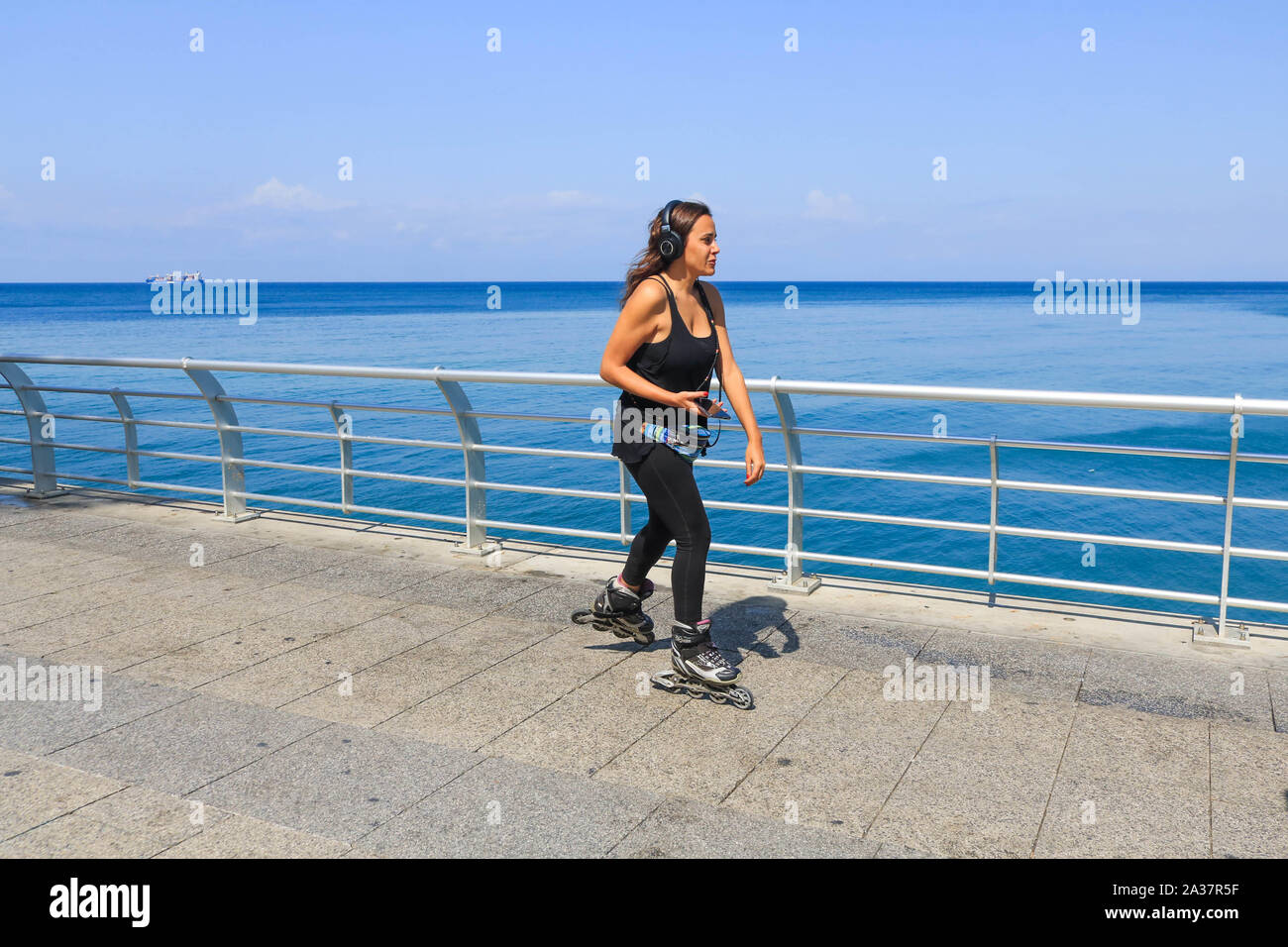 October 6, 2019, Beirut, Lebanon: A woman roller skates during the hot and humid day in Beirut. (Credit Image: © Amer Ghazzal/SOPA Images via ZUMA Wire) Stock Photo