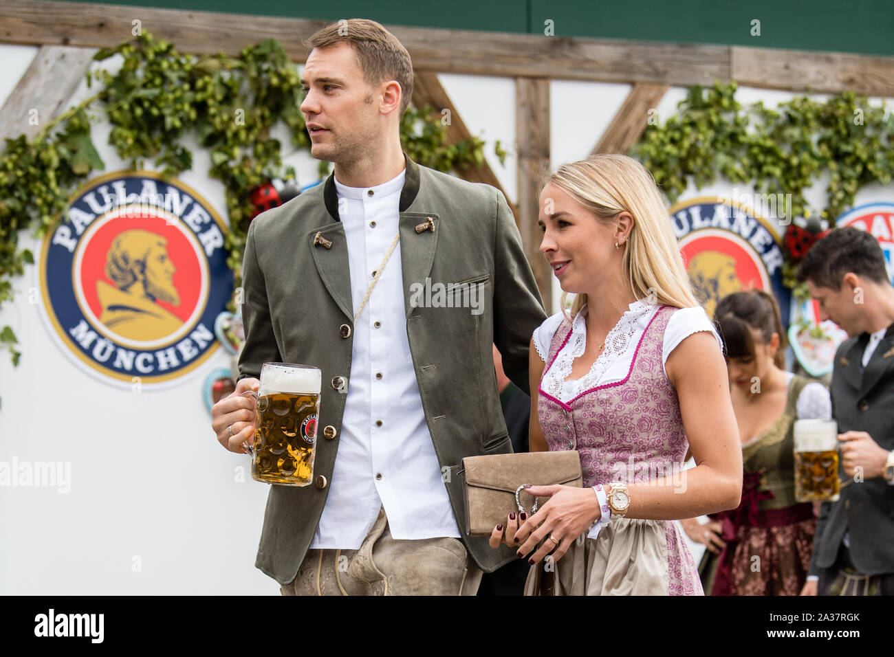 Munich, Germany. 06th Oct, 2019. Goalkeeper Manuel Neuer and his wife Nina Weiss come to the beetle tent at the Oktoberfest on the Theresienwiese. Players, coaches and managers of the Bundesliga soccer team FC Bayern traditionally visit the Käfer tent together once during the Oktoberfest. Credit: Matthias Balk/dpa/Alamy Live News Stock Photo