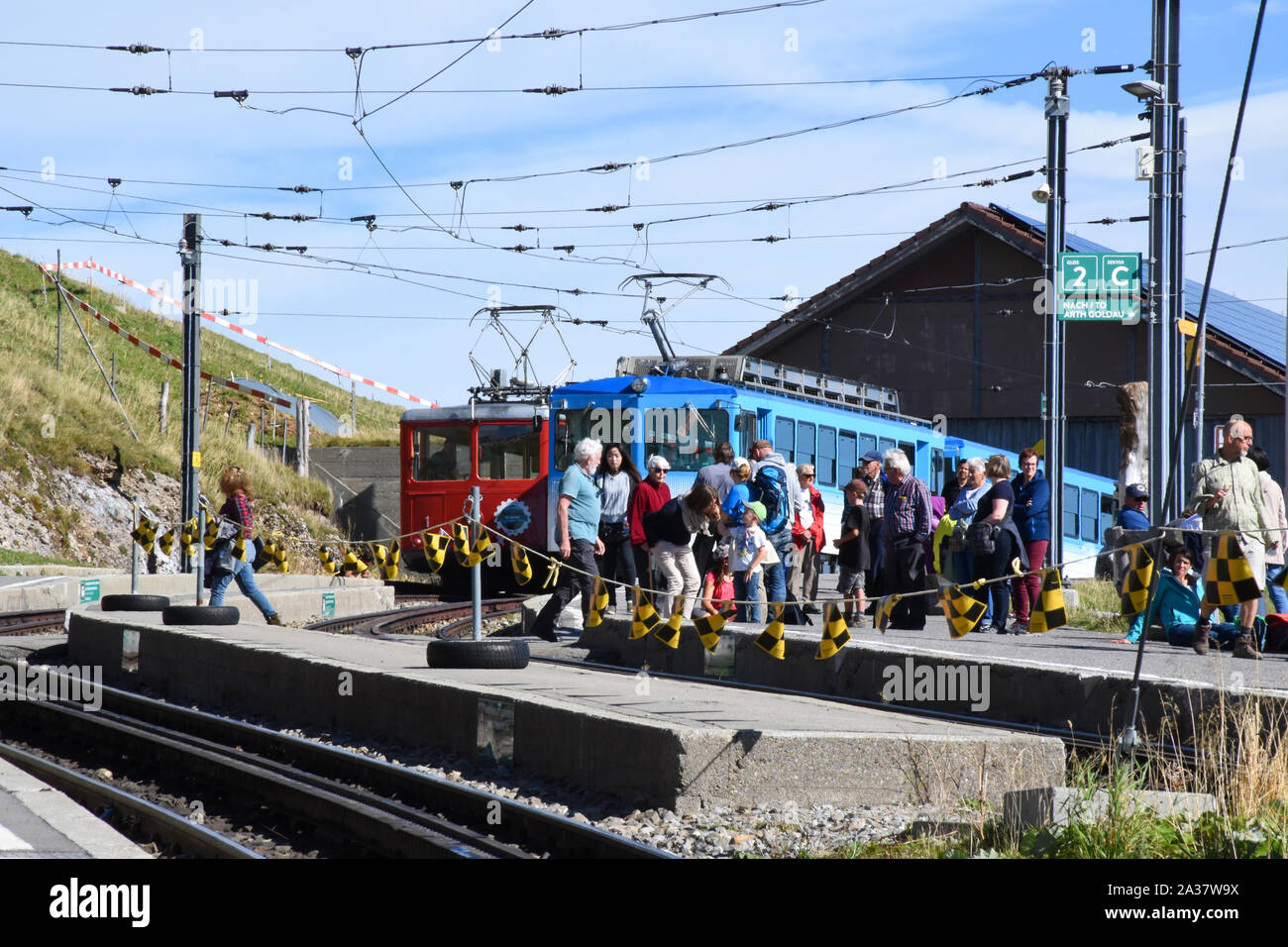 Arth, Switzerland 09.29.2019. People arrived to the end station of the Vitznau and Rigi Kulm cogwheel railway at the top of Mount Rigi Stock Photo