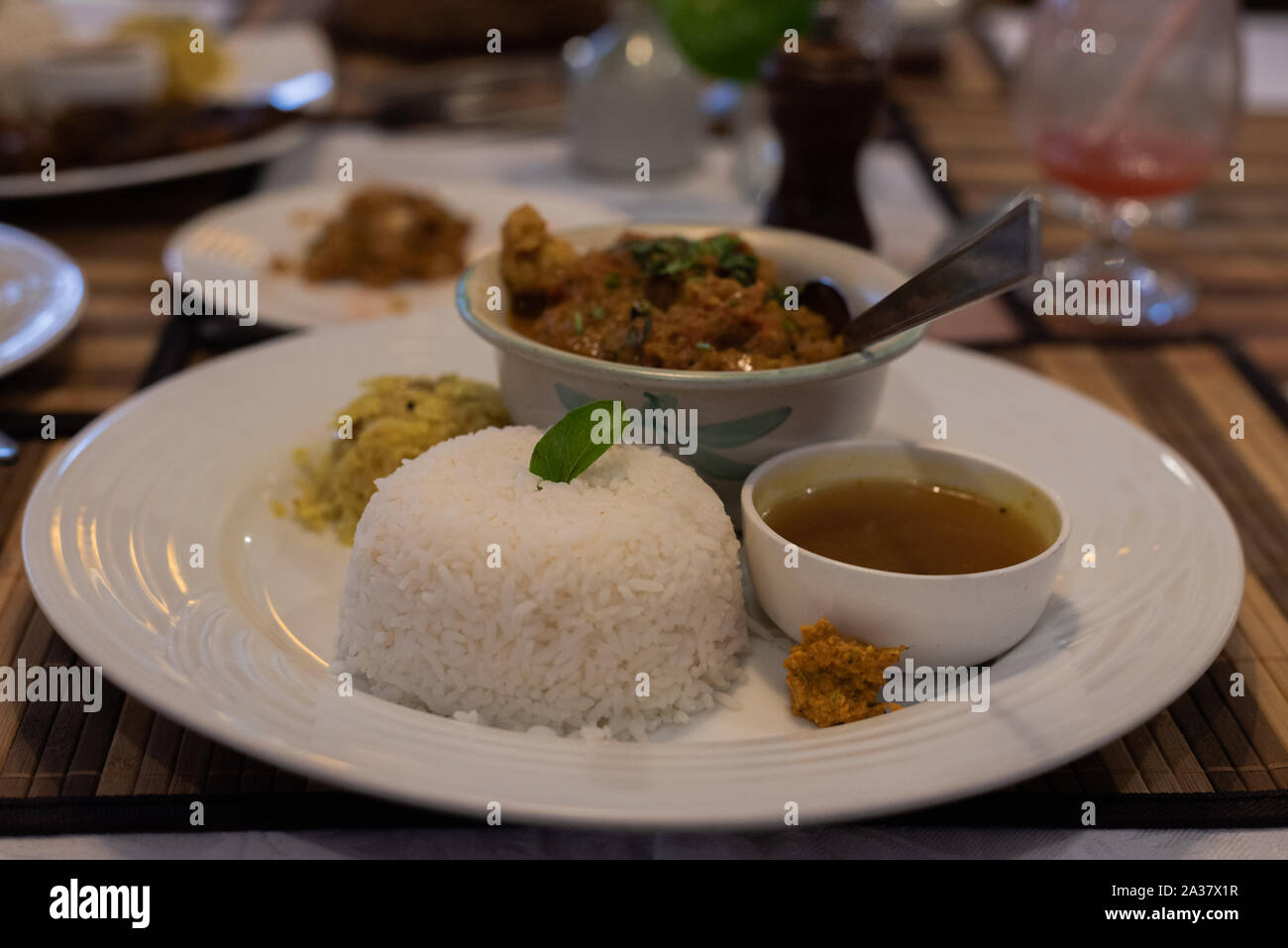 Flavourful south Indian seafood and rice meal served in a restaurant Stock Photo