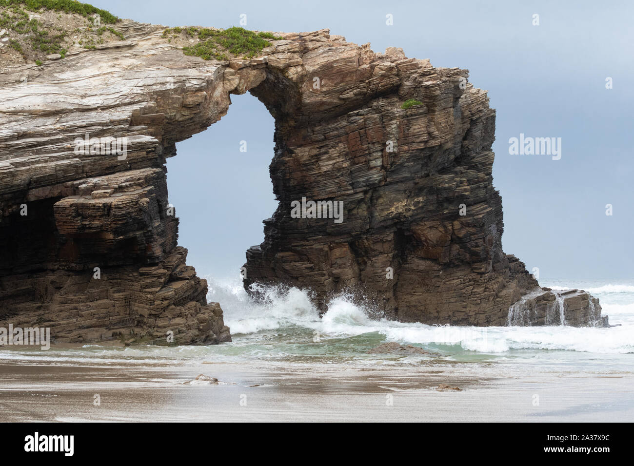 natural stone arch at Beach of the Cathedrals - Praia de Augas Santas, Galicia, Spain Stock Photo