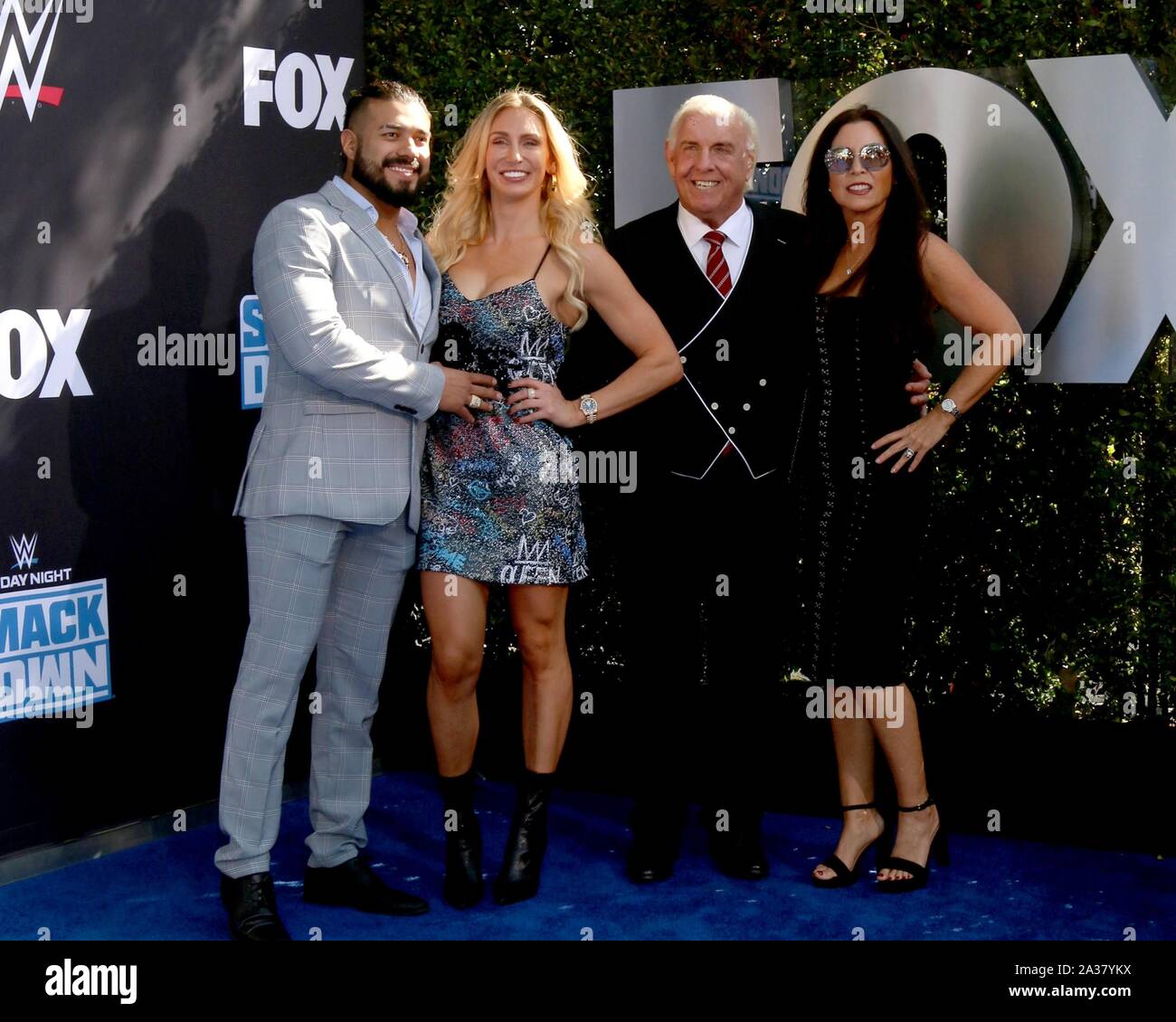 Los Angeles, CA. 4th Oct, 2019. Guest, Charlotte Flair, Ric Flair aka Richard Morgan Fliehr, guest at arrivals for WWE 20th Anniversary Celebration SmackDown Premiere, STAPLES Center, Los Angeles, CA October 4, 2019. Credit: Priscilla Grant/Everett Collection/Alamy Live News Stock Photo