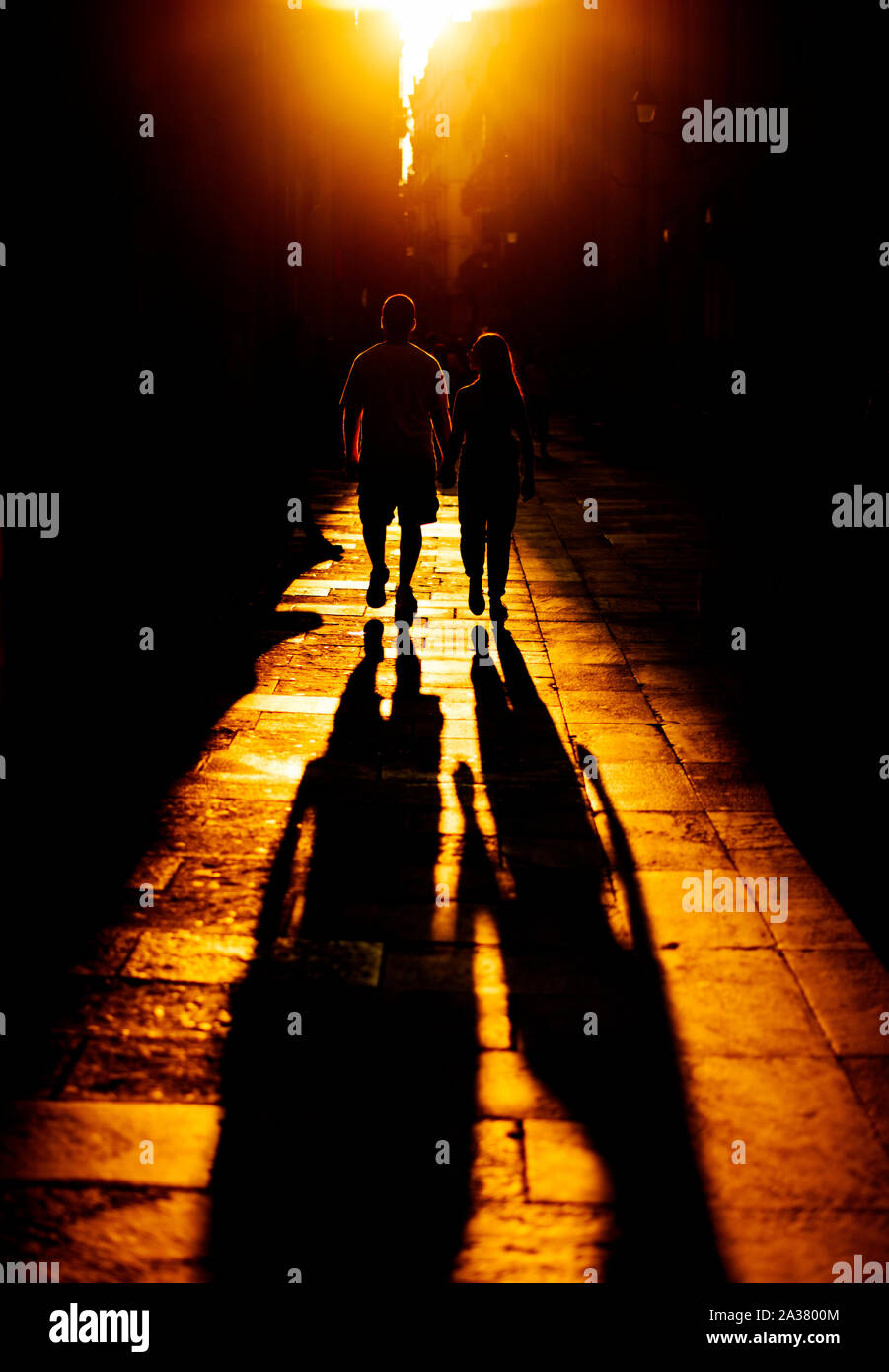 shadow of a young couple at golden hour in Barcelona Stock Photo