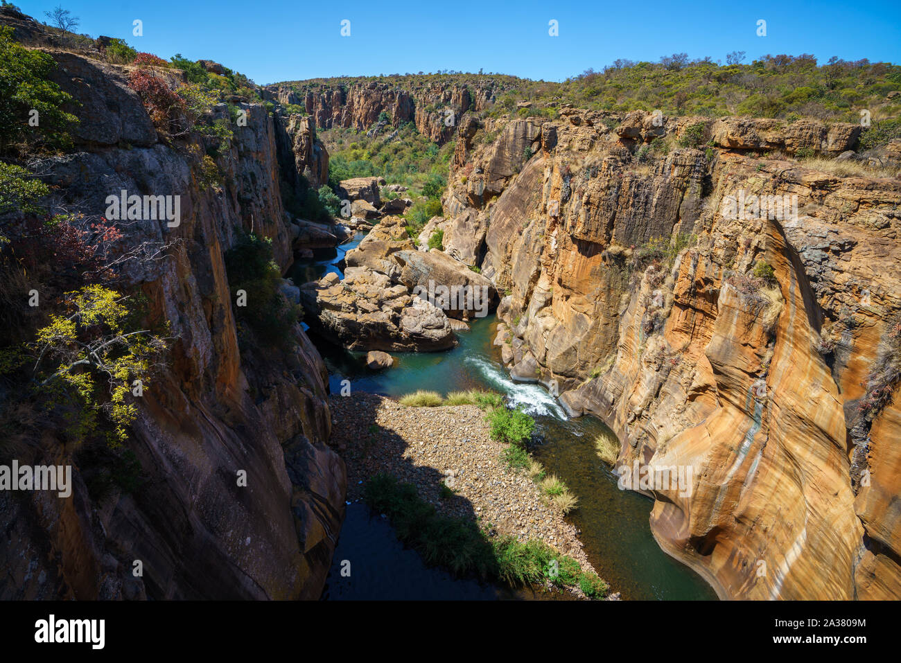 steep walls of red sandstone at bourkes luck potholes, mpumalanga, blyde river canyon, south africa Stock Photo