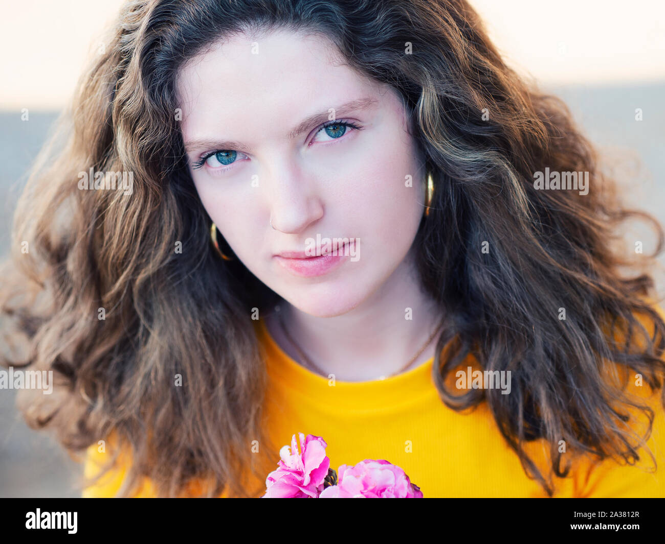 Beautiful Young Woman With Thick Wavy Hair Casually Dressed Stock Photo Alamy